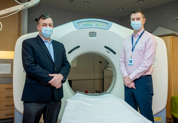 Dr. Colm Boylan and Dr. Greg Rutledge with one of St. Joe's CT Scanners