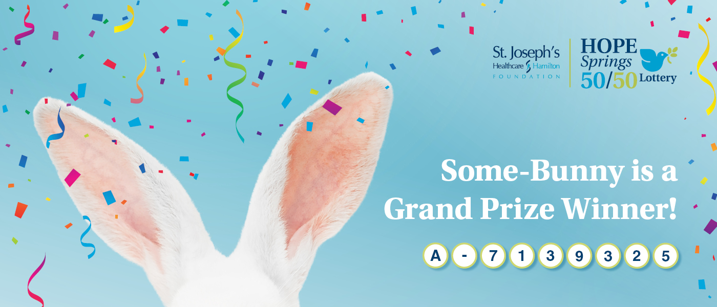 Confetti falls on a pair of rabbit ears with the following text: "Some-Bunny is a Grand Prize Winner! A-7139325" in the bottom-right corner. St. Joe's Hope Springs 50/50 Lottery logo appears in the top-right corner.