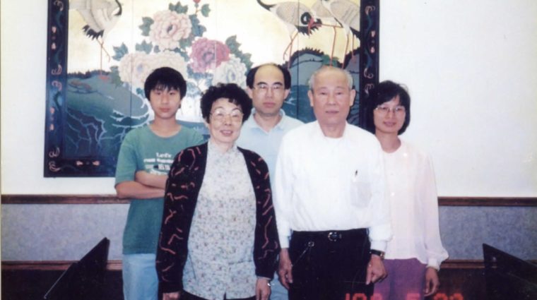 Kenny with his parents and grandparents.